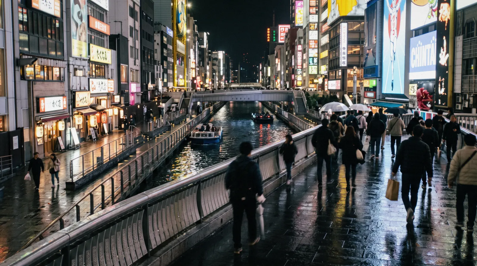 Neon signs above the canal seen from Ebisubashi bridge at dusk in Dotonbori, Osaka Japan