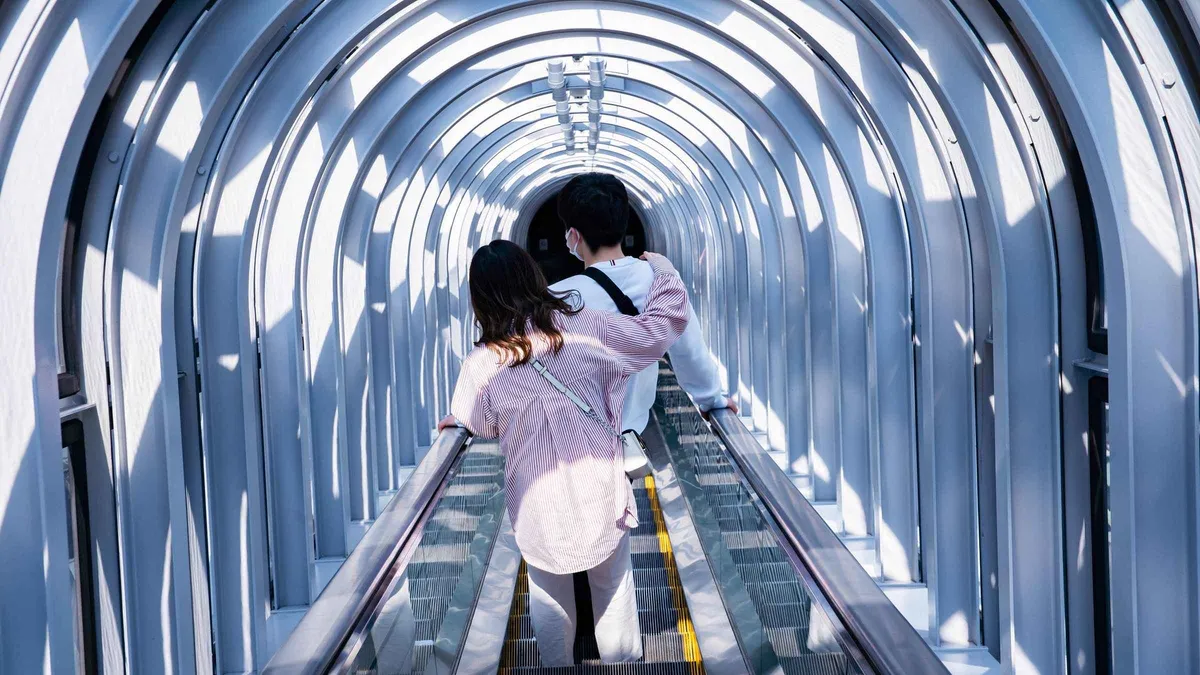 Visitors on the open rooftop ring of the Umeda Sky Building observatory, Osaka Japan