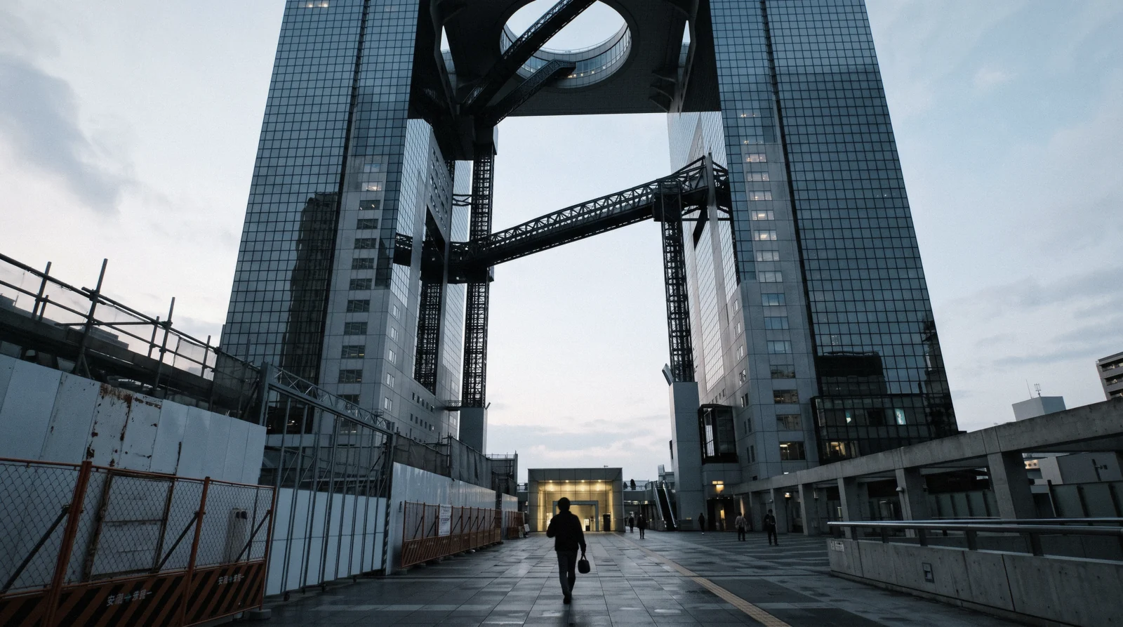 The linked twin towers and rooftop ring of the Umeda Sky Building against an evening sky, Osaka Japan